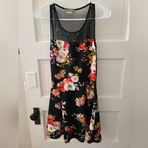 Above knee length sleeveless cocktail dress with see thru mesh neckline